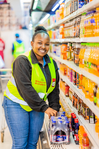 A Transmatt team member restocking drinks